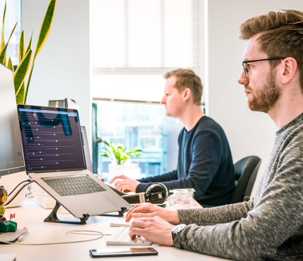 IT support services team working on computer